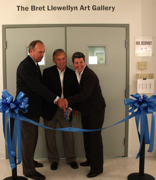 Anderson, Llewellyn, and Bracket, cut the ceremonial ribbon.