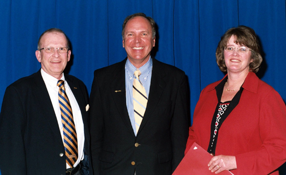 Joseph Damrath, President Dr. John M. Anderson, and April Lawrence