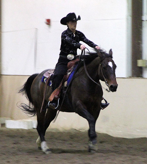 Justine Burnett in a reining class.