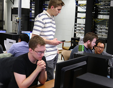 male students in a computer lab