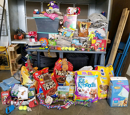 items collected for local animal shelters during a recent food and supply drive; dog food, chew toys, etc.