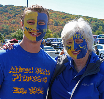 Patricia K. Fogarty with a student at homecoming 