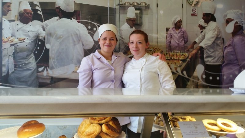two female students in a bakery