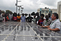 Jeffrey Stevens with group of people in front of a large solar panel