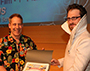 Jeremy Speed Schwartz, right, receives his award for first place from Animator Robert Lyons