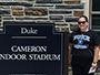sport management major Kiana Sleight next to Duke stadium sign