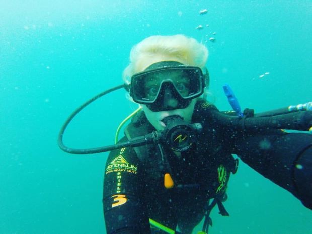 female under water wearing scuba gear
