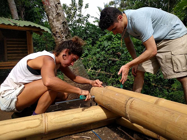 Mathew Watson, right, female on left, with bamboo