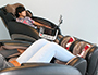 Two students relaxing in massage chairs 