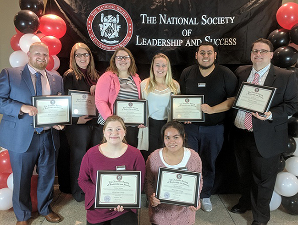 new members of Alfred State’s chapter of the National Society of Leadership and Success holding their certificates