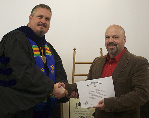 professor and student, holding a certificate