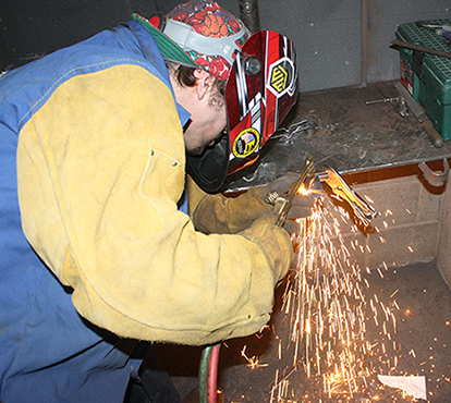 high school student competes in the welding contest during the 27th annual SkillsUSA Region I Leadership Conference and Skills Olympics