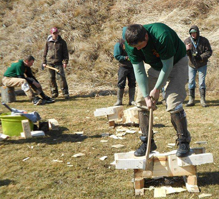 Pioneer Woodsmen’s Club member Gavin Maloney, a masonry major from Rome, NY, performs an underhand chop
