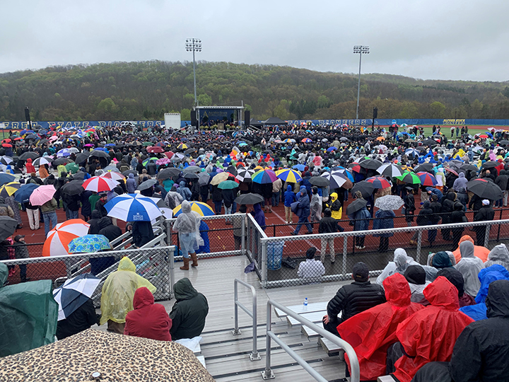 Pioneer Stadium filled with rain ponchos and umbrellas