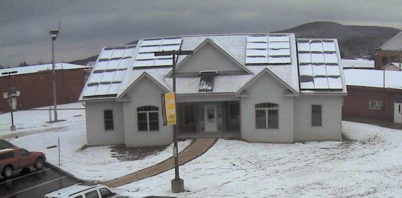 Zero Energy Home covered in snow on the roof