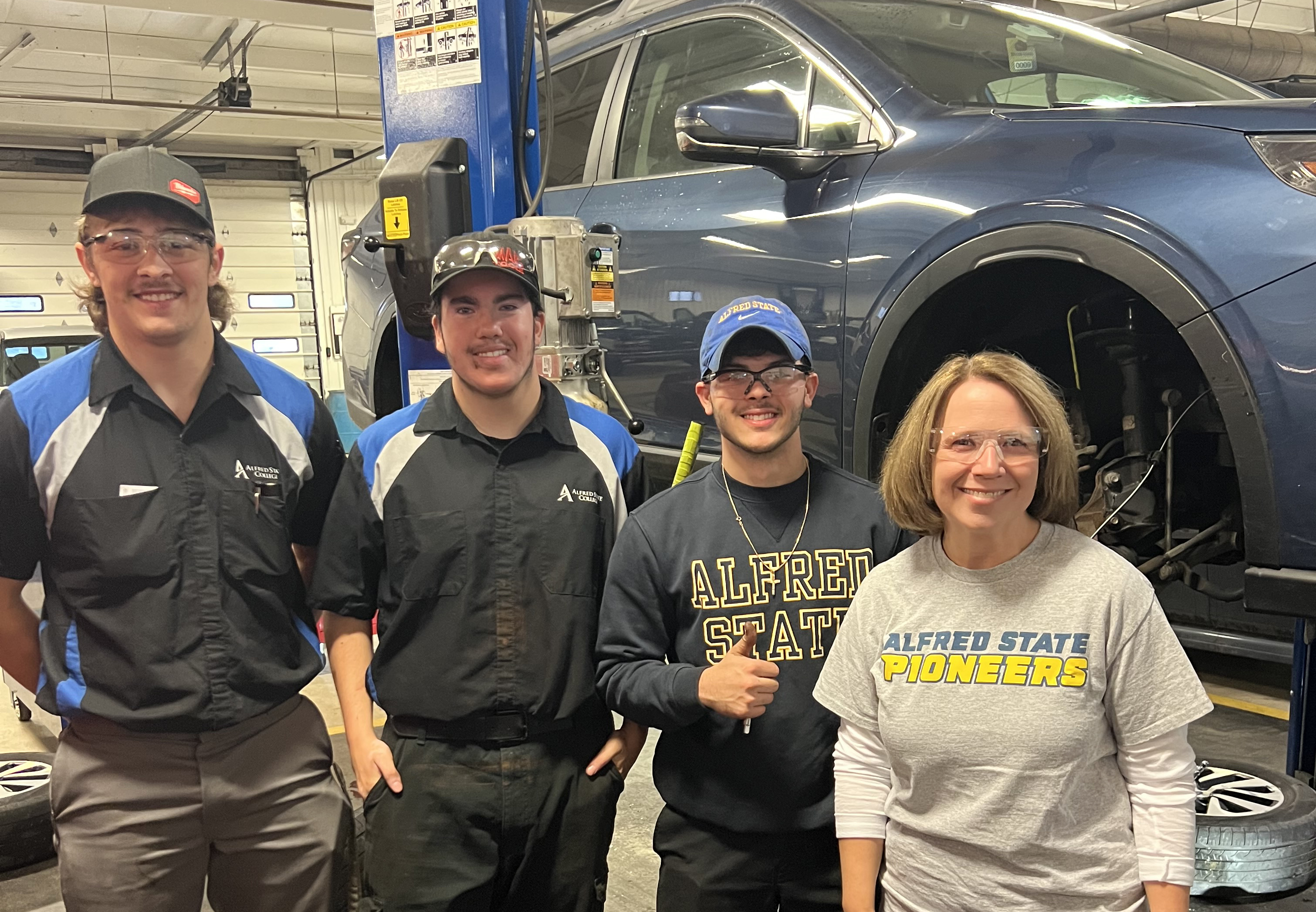 Carrie Cokely with automotive students