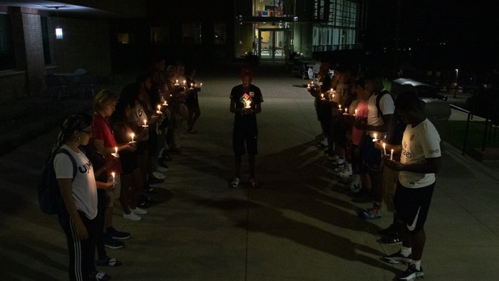Students in UJIMA host a candle light memorial for the victims of 9/11