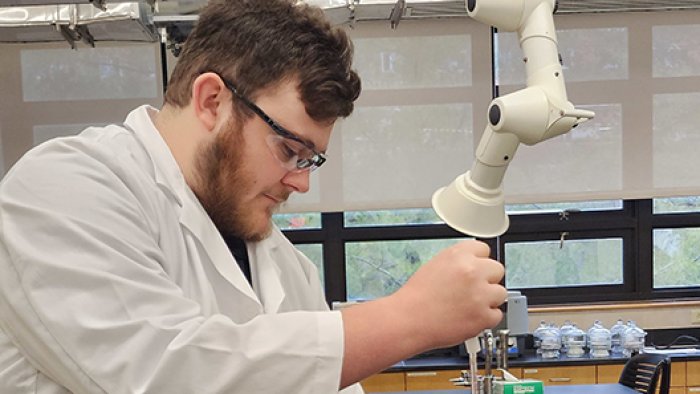 An Alfred State student works in a lab. Alfred State ranks high with health, science, and human services majors.