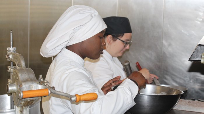 Culinary Arts students work in the kitchen.
