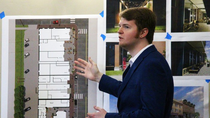An architecture student presents his project on the redesigning of the Village of Alfred downtown business area.