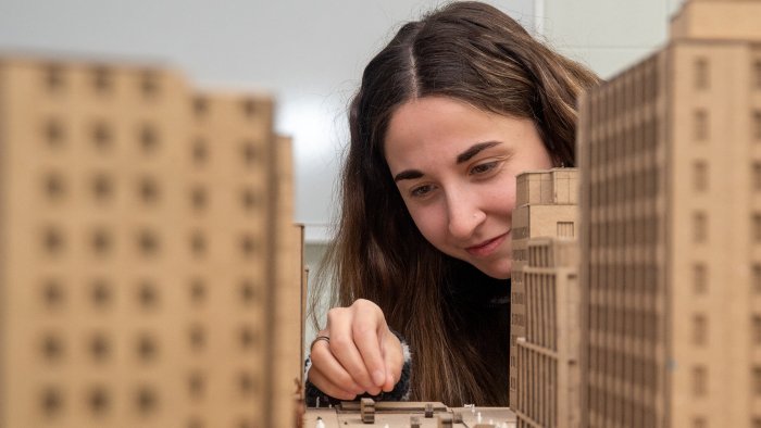 student works on an architectural model