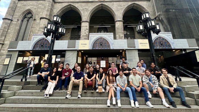 Alfred State architecture students sit in front of Notre-Dame Basilica in Montreal