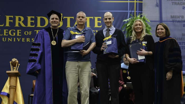 Faculty members are recognized for their work with students.