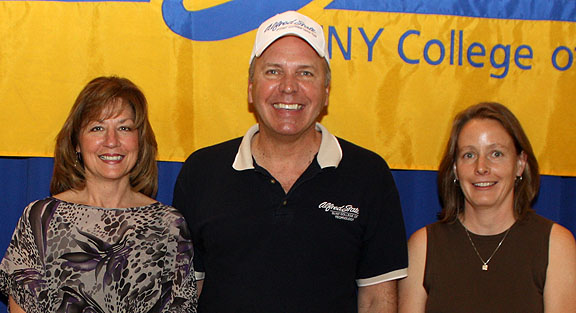 Annette Burdett, President Dr. John M. Anderson, and Deborah Claire