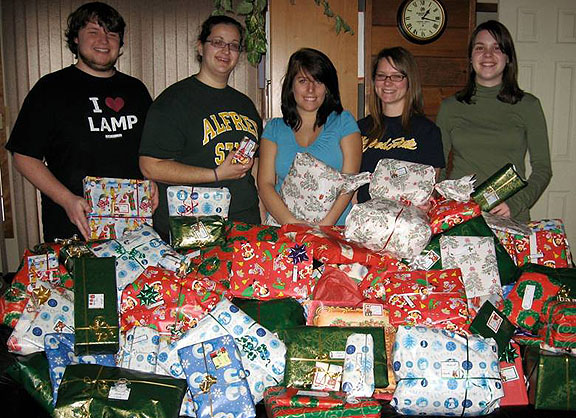 WINS Club members with presents for a local family