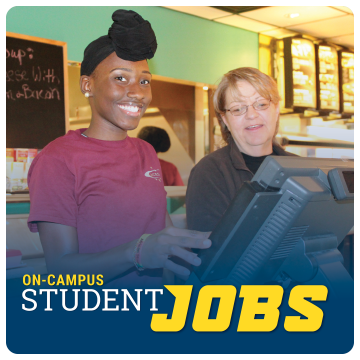 Link to student employment page. On-campus student jobs. Image of student worker at Central Dining Hall ready to take an order.