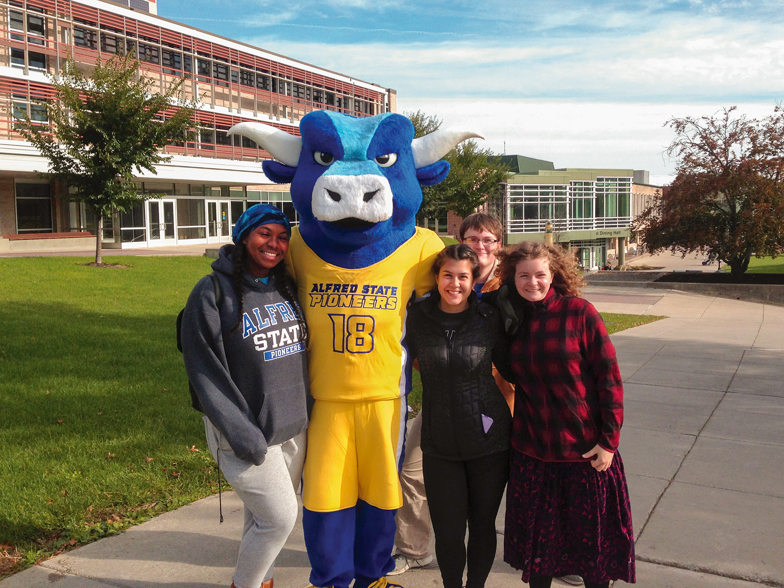 Big Blue ASC mascot standing with students