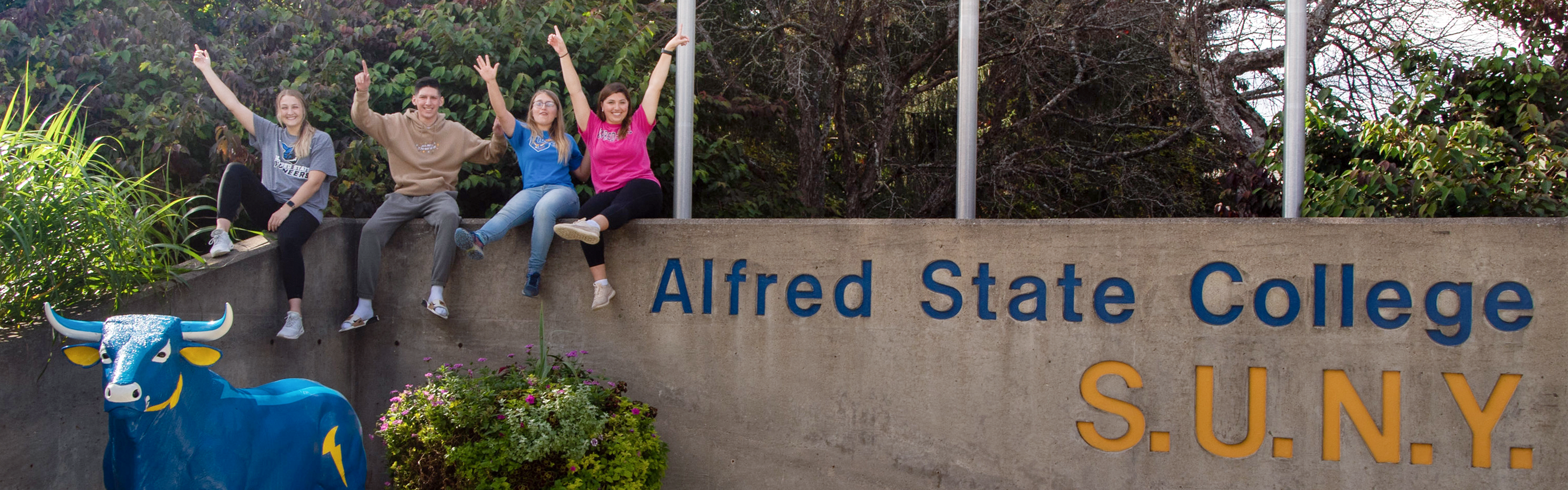 ASC Campus entrance with four students