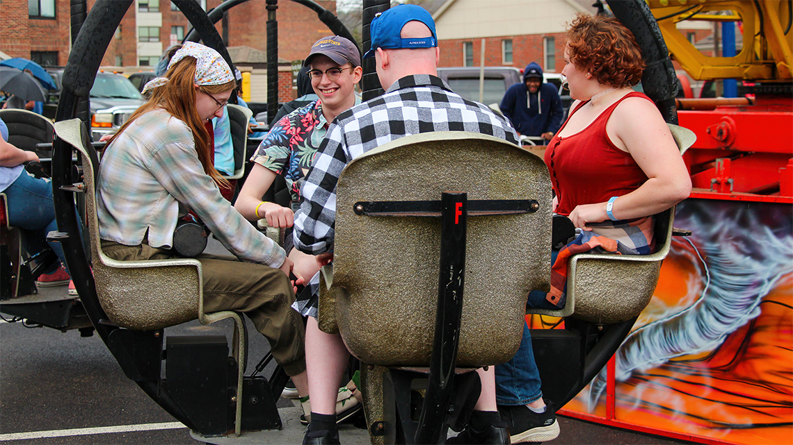 Students enjoy one of the rides at the Alfred State Carnival. The carnival was part of Hot Dog Day festivities.