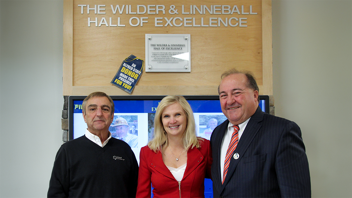 J. Joseph Wilder and his wife Laura Linneball pose with Joseph S. Laraiso ’67.