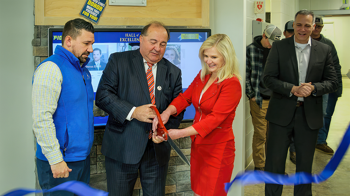 J. Joseph Wilder ’77 and his wife Laura Linneball cut the ribbon at the Hall of Excellence located in the Workforce Development Center on the Wellsville campus. Joining them are Director of Development Jason Sciotti (far left) and ASC President Dr. Steven Mauro (far right).