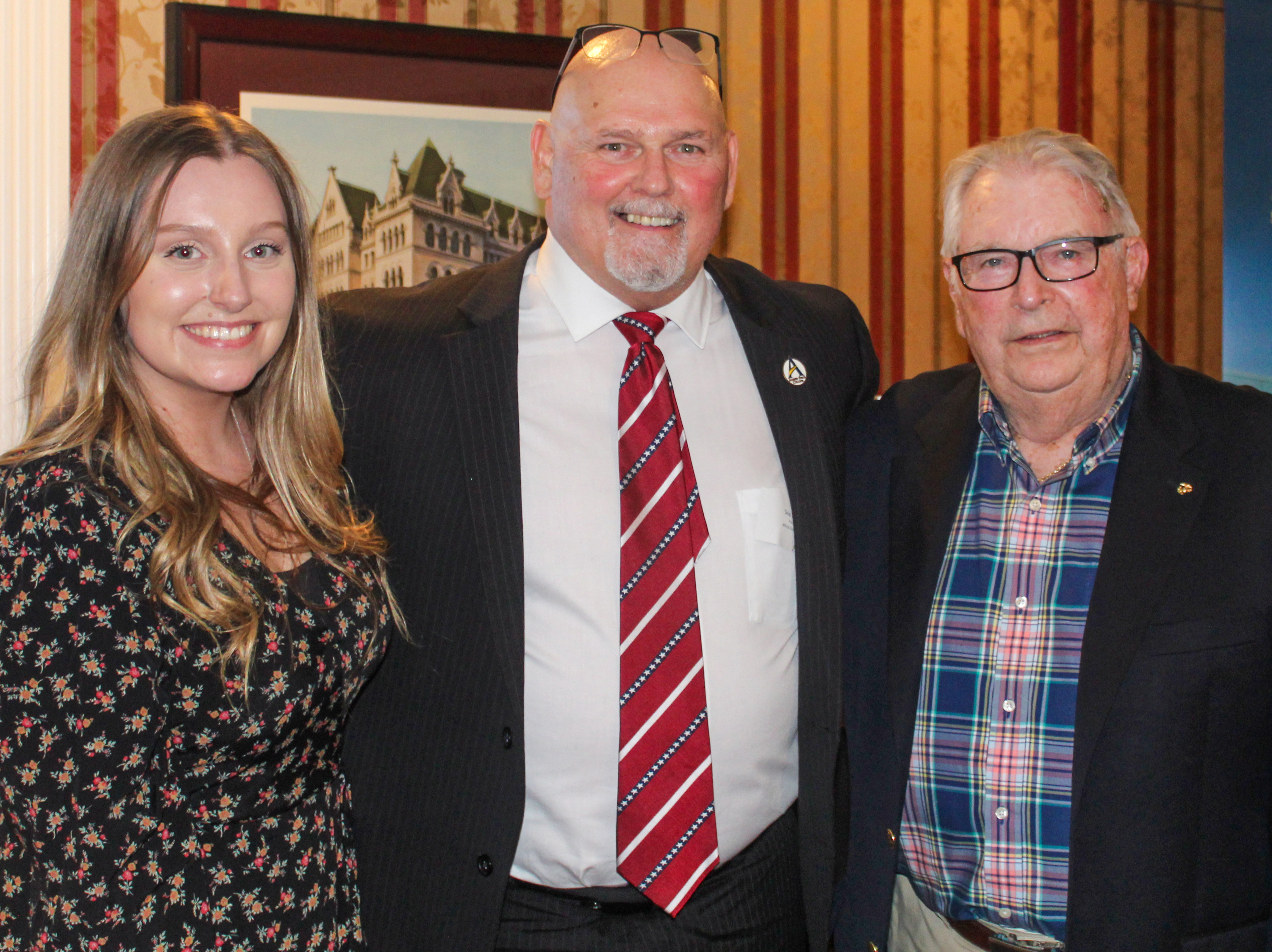 Nicole Donnelly, ’19; Alfred State President Dr. Skip Sullivan; and Theta Gamma brother Earl Herrington, ’58
