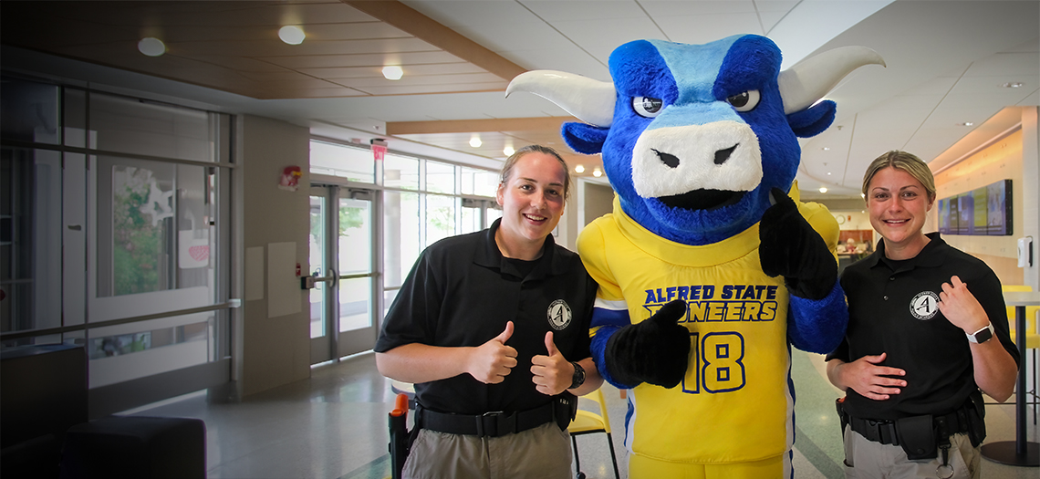 Photo of 2 female Police Academy cadets with Big Blue