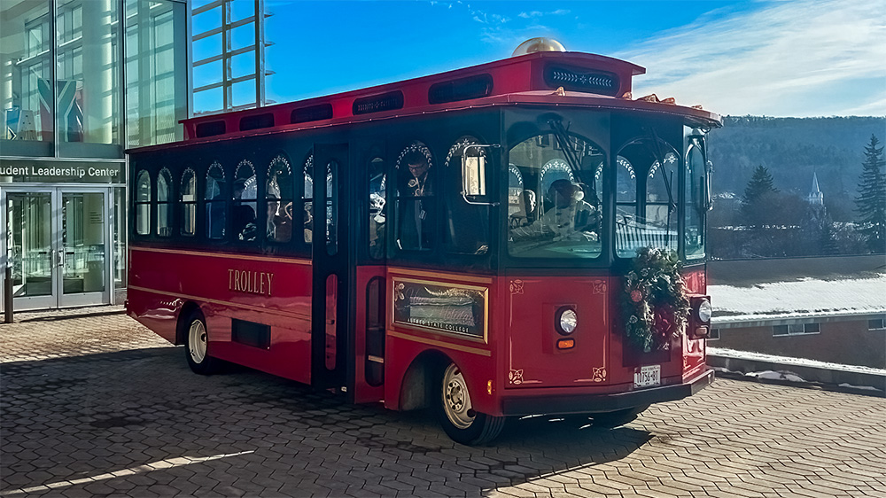 Photo of the trolley outside of the Student Leadership Center before driving up campus.