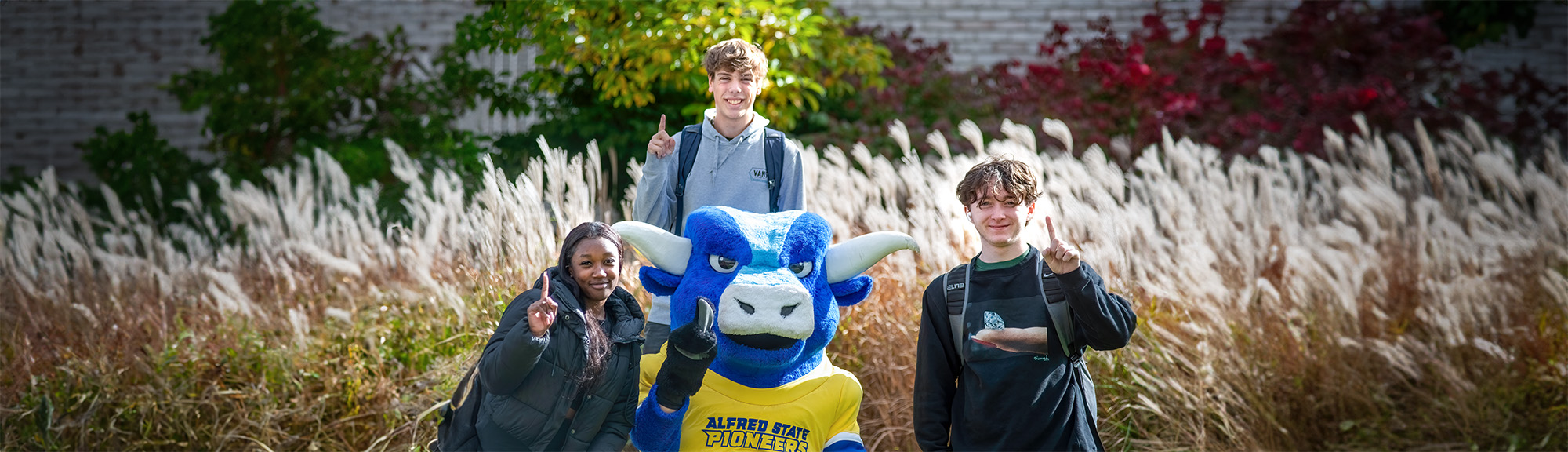 Three ASC students with Big Blue