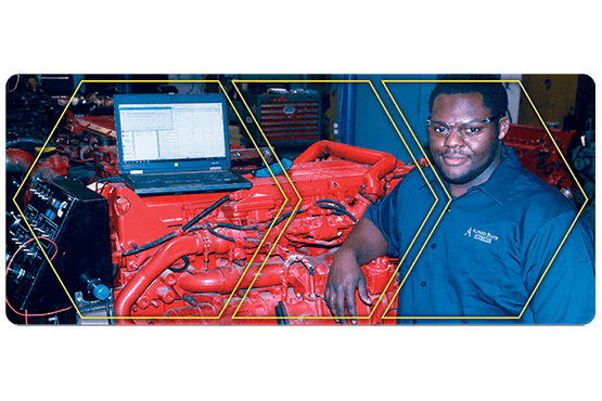 Nizair Evans in a lab with auto equipment