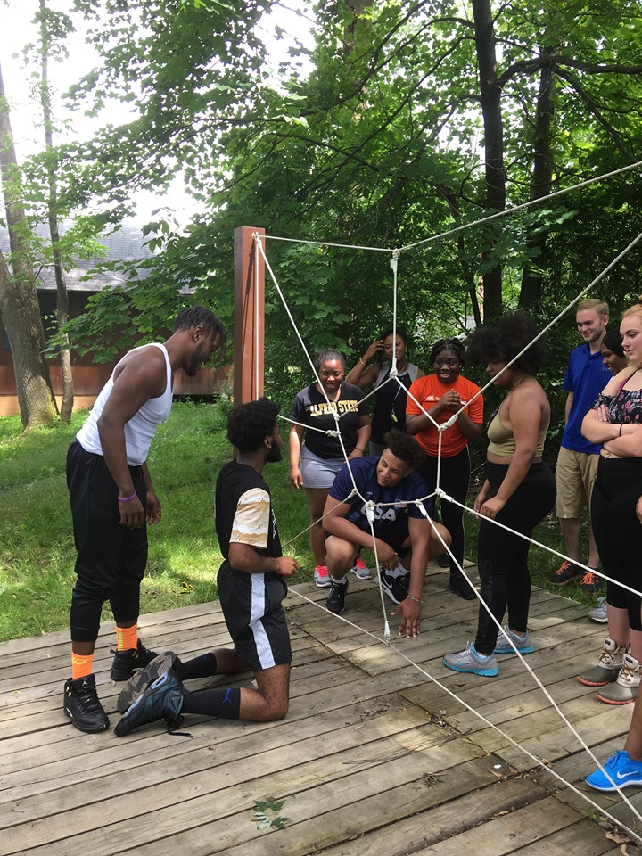 students with a rope puzzle