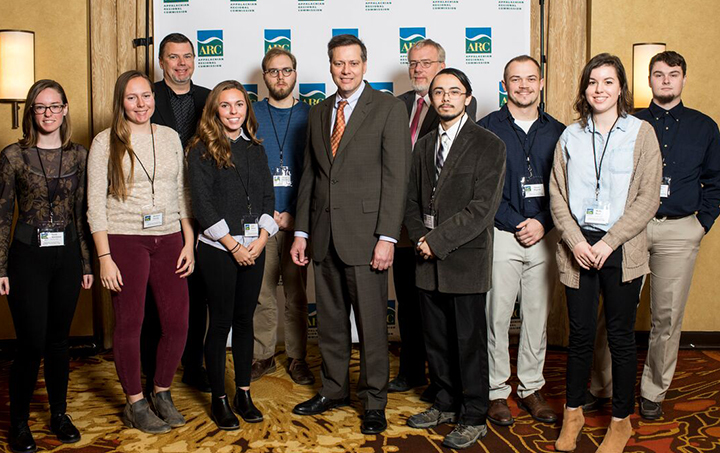 group of students and professors standing