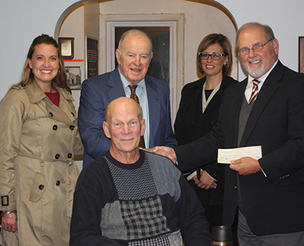 Phil Loree, back row, second from left, President Dr. Skip Sullivan, Fred Marks, sitting; Danielle White, back row, first from left; and Bridgett Mayorga