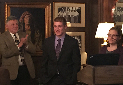 Brandon Holley, center, at awards ceremony