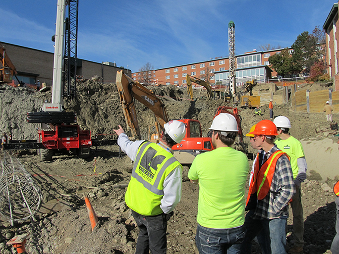 construction management students gain valuable experience by learning on site from industry professionals