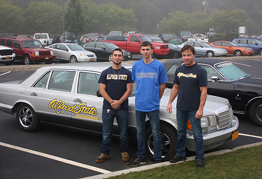 members of the 2015 Alfred State Fireball Run team, along with the 1987 Mercedes 300 SDL they will be driving in the event