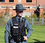 Officer Corwin Mackney wearing a hat and uniform