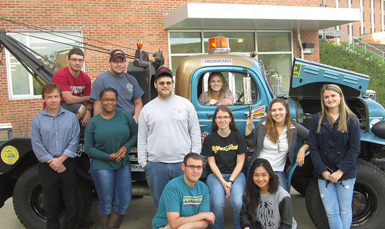 students in front of a truck