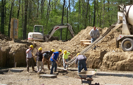 students building house 54 in Wellsville