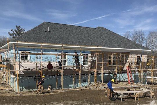 students working on the house during the spring of 2018.